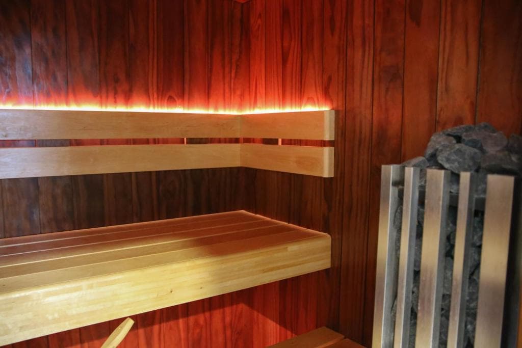 Warm-lit private sauna interior