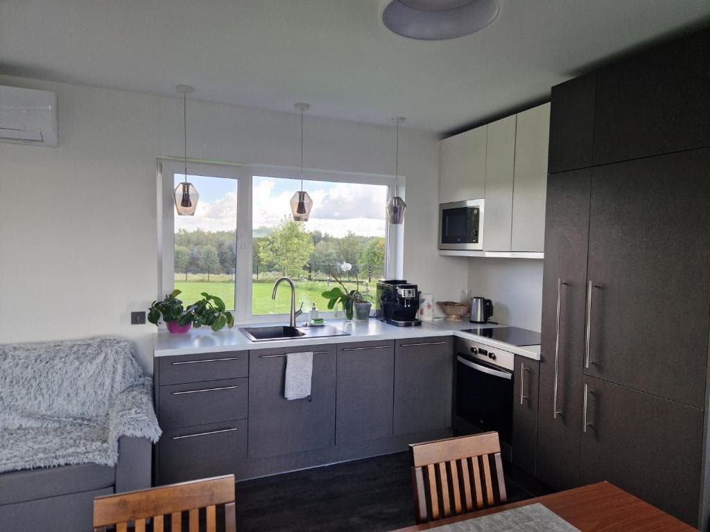 Fully equipped kitchen with a window view over the fields